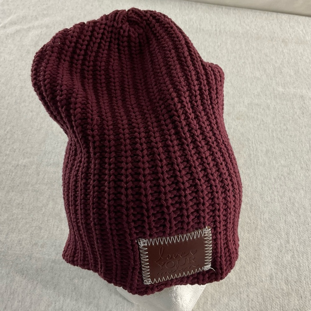 LOVE YOUR MELON 100% COTTON WOMEN’S BEANIE FEATURES A RED MAPLE LEATHER PATCH